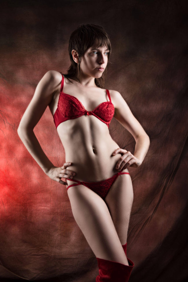 Image of Melancholic posing in red lingerie