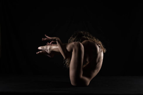 Image of Vivian Cove nude on black background