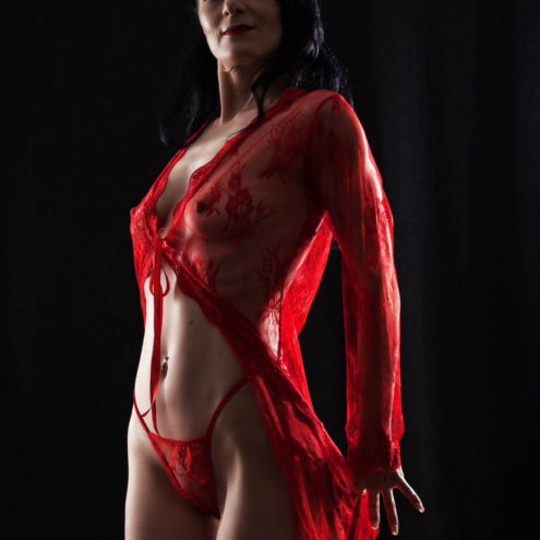 Image of June Cherry wearing a sexy red outfit