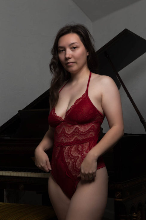 Leeah Michelle sporting a maroon bodysuit