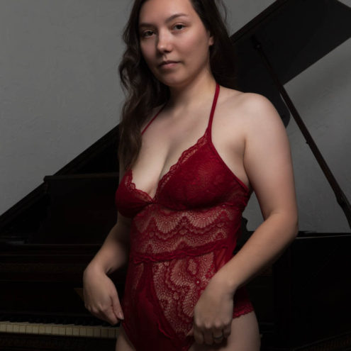 Leeah Michelle sporting a maroon bodysuit