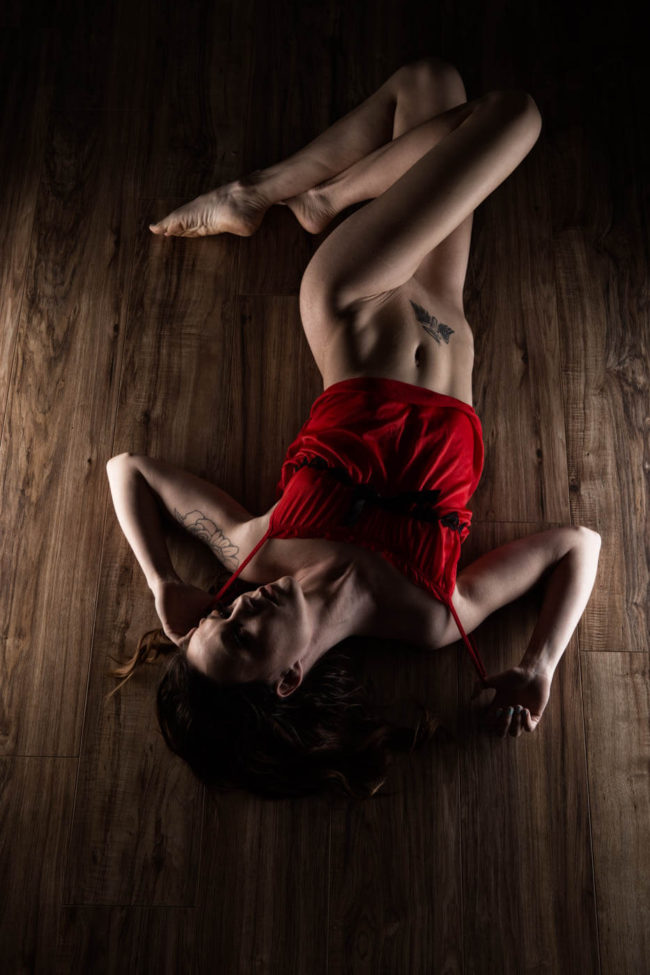 Cat H Marie is floored wearing red