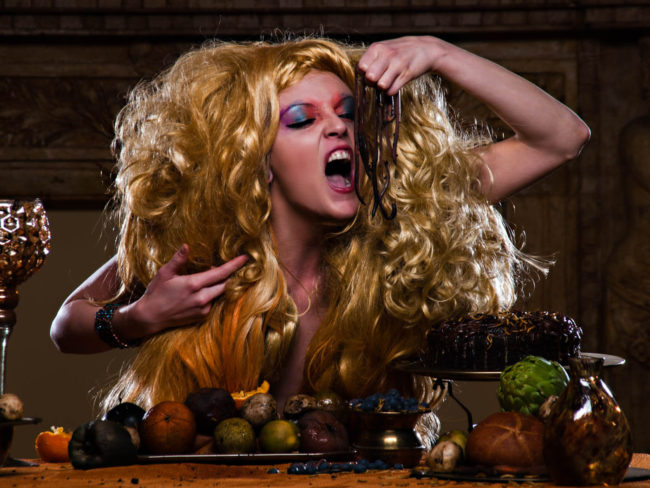 Image of Kari Michelle eating worms in gluttony