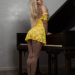 Image of Liz Ashley in a bright yellow dress.