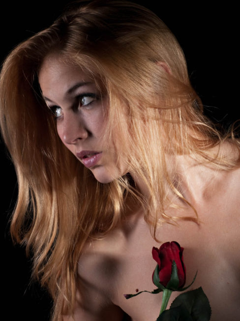 Dark Art image of Ryan Leigh holding a rose