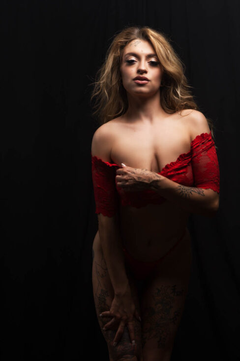 Glamour image of Jess Glitches in a red hot outfit